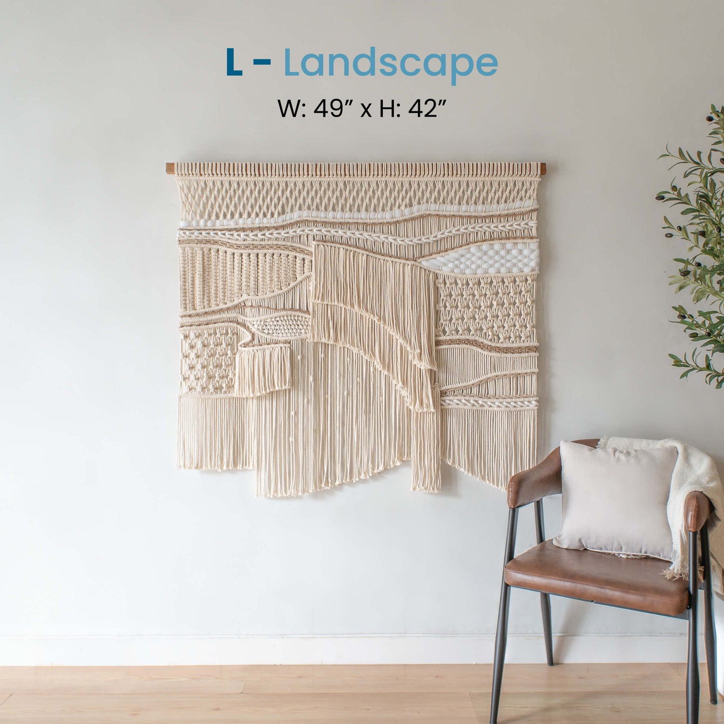 Large landscape ASAH macrame wall hanging, measuring 49 inches wide by 42 inches tall, displayed in a modern living space with nature-inspired patterns and textures